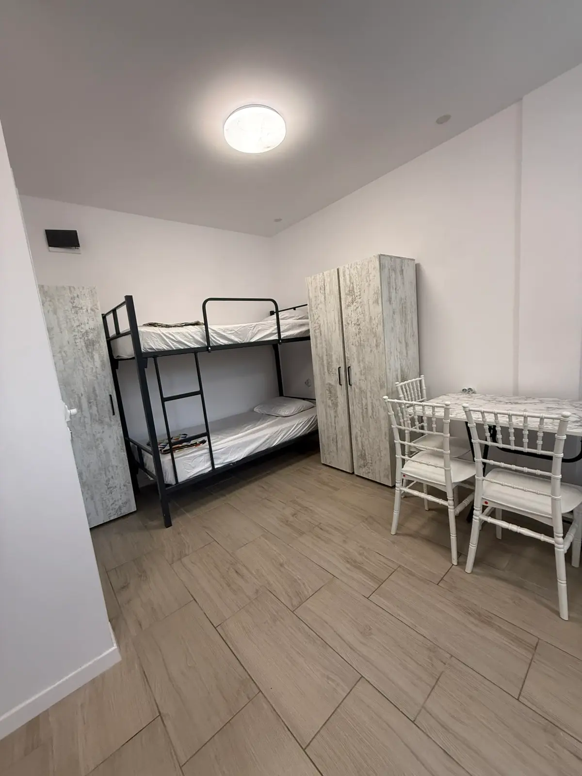 Bunk bed and wardrobe in an SJK Group room