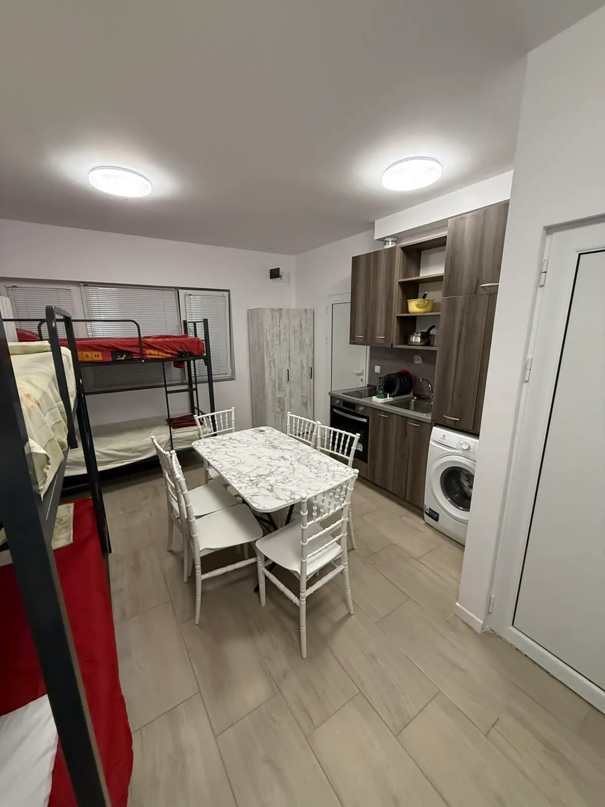 Dining table and bunk beds in a shared room