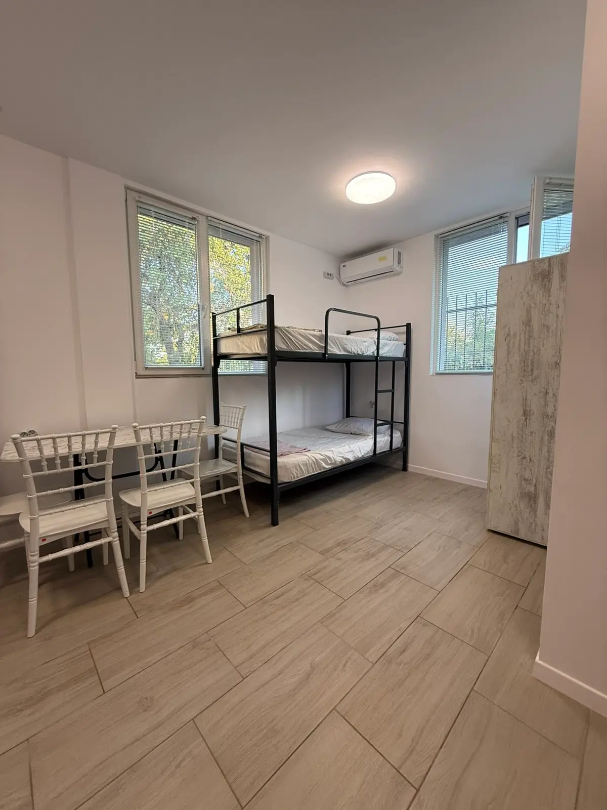 Bunk beds and air conditioning in a worker room